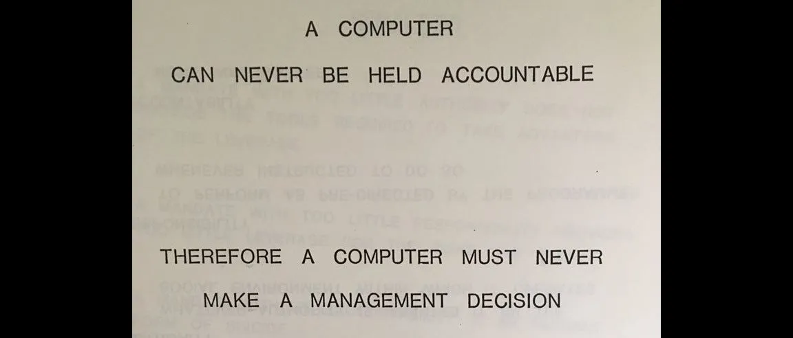 Sign saying 'a computer can not be made accountable, therefore a computer must never make a management decision